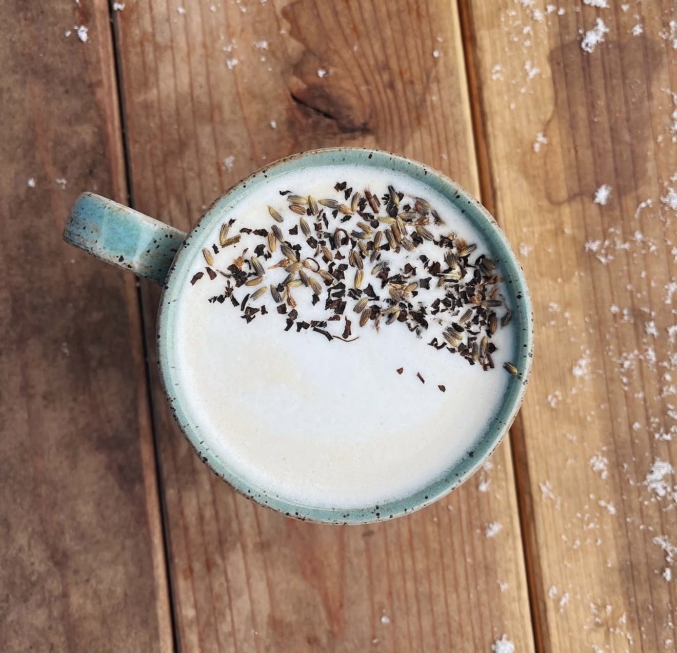 Lavender latte topped with dried botanicals