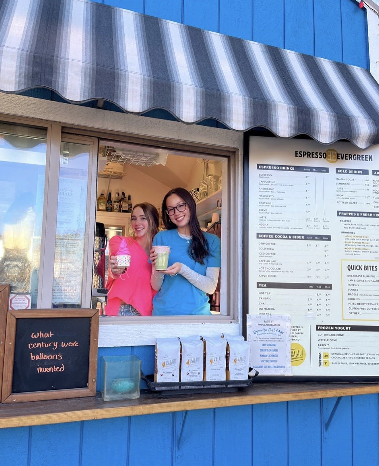 Baristas smiling at the Espresso Evergreen window